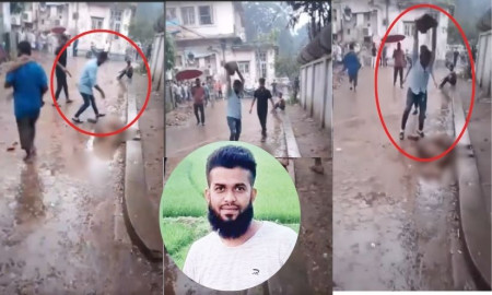 বড় পাথর মারা সাদা শার্ট-জিনস পরা ব্যক্তিটি কে?