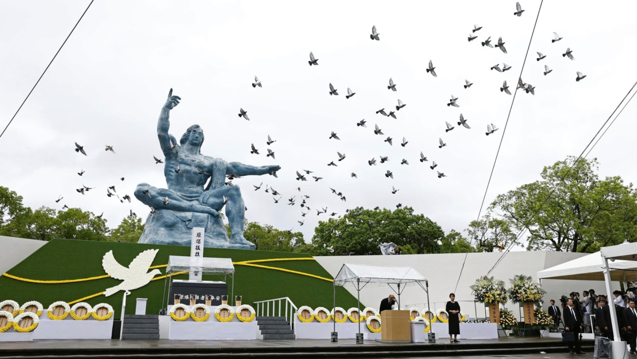 Doves are leased over the peace statue in Nagasaki, during a ceremony to mark the 80th anniversary of the US atomic bombing