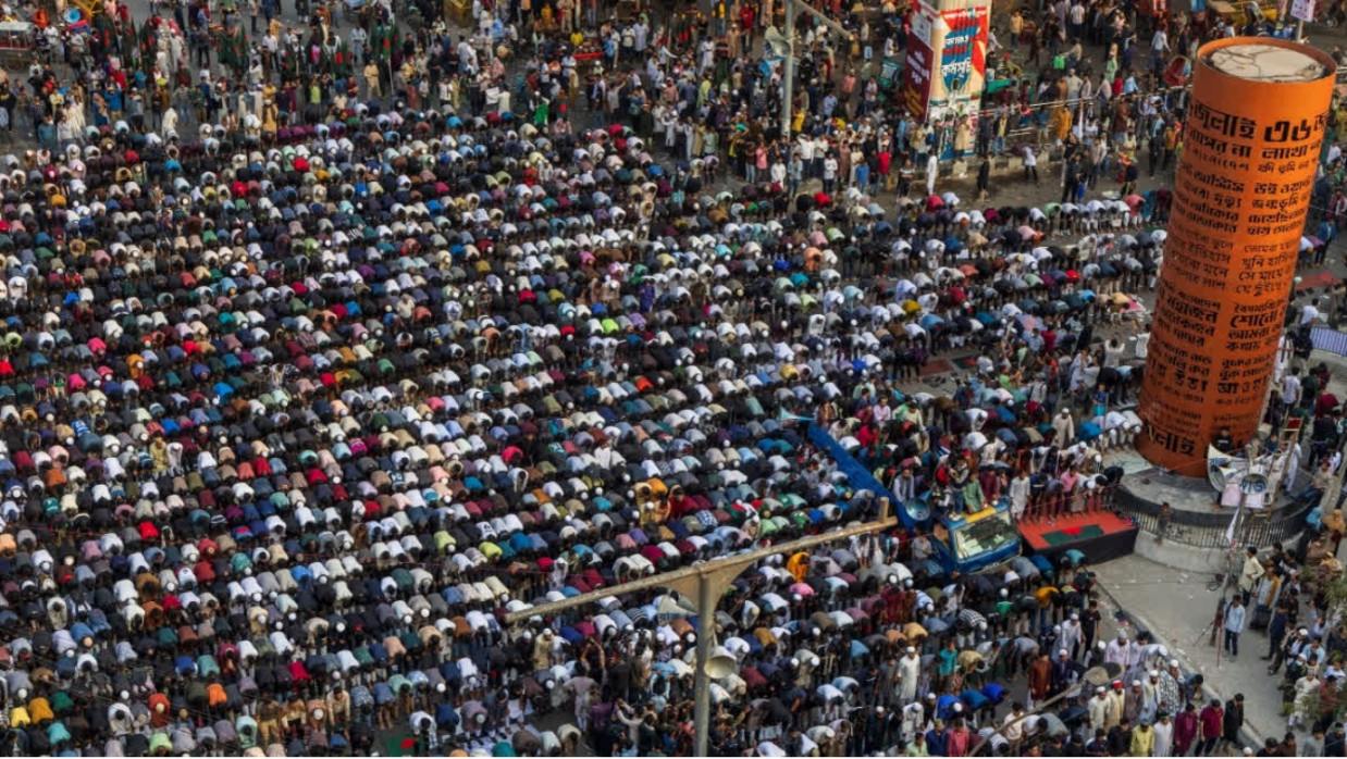 An aerial view shows protesters offering prayers at Shahbagh intersection in Dhaka on December 19, 2025, following the death of youth leader Sharif Osman Hadi