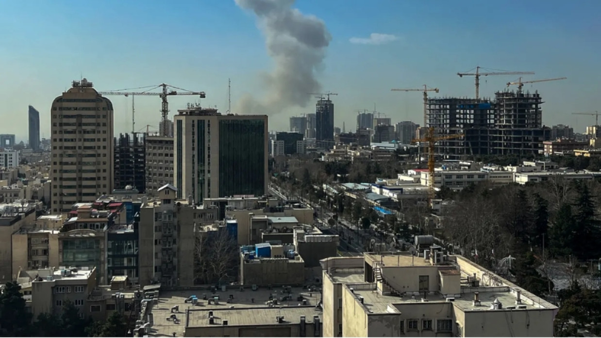  A plume of smoke rises following a reported explosion in Tehran on February 28, 2026