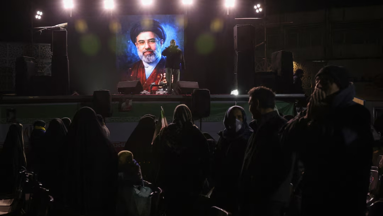 Iran's new supreme leader, Mojtaba Khamenei, is displayed on a screen in Tehran