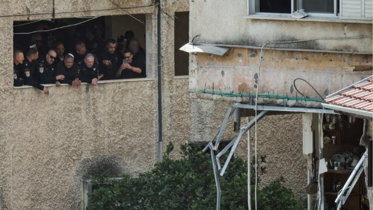 Israeli National Security Minister Itamar Ben-Gvir visits the site of a projectile impact