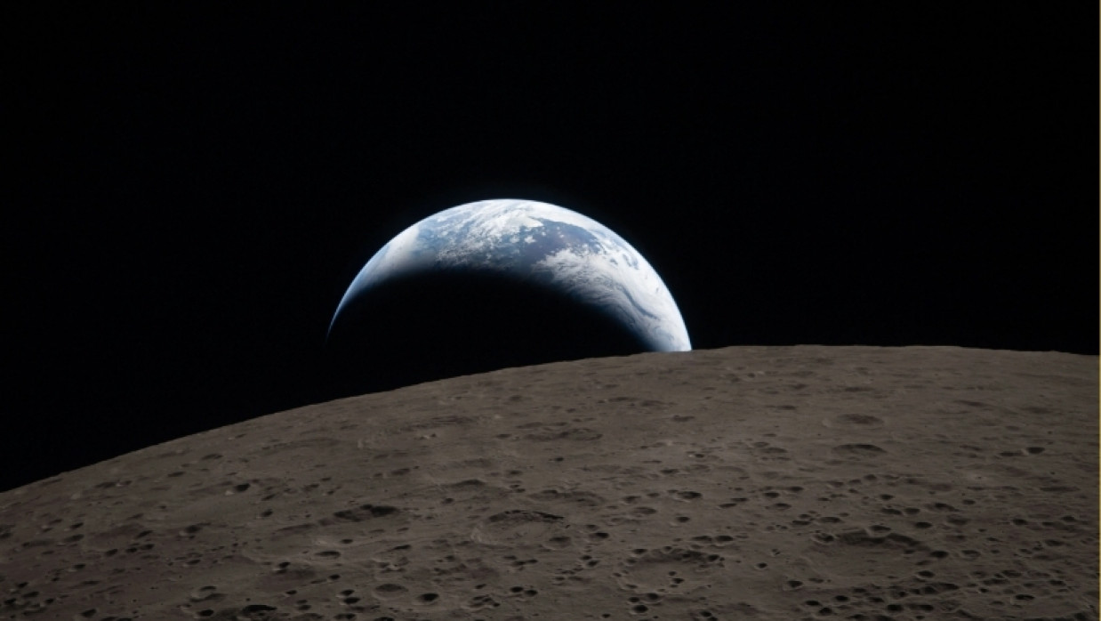 Earthset captured through the Orion spacecraft window on April 6, 2026, during the Artemis II crew's flyby of the Moon