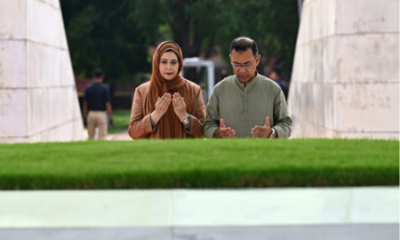 PM visits parents' graves, offers prayer