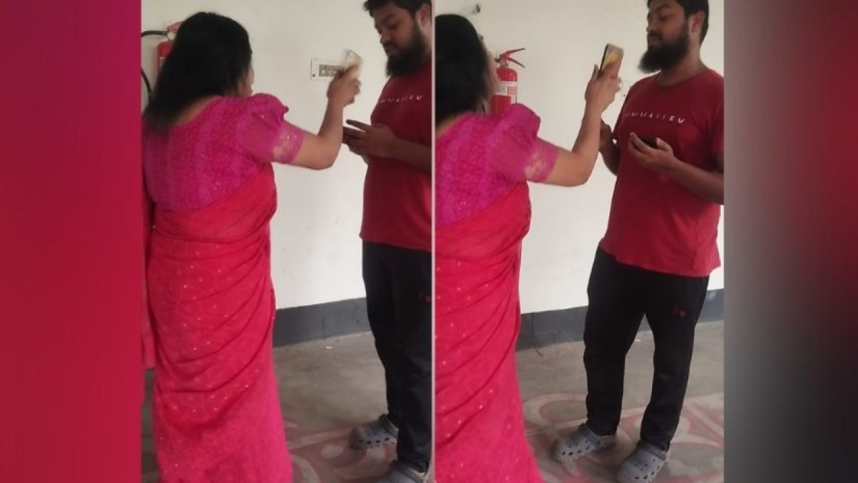 সংবাদকর্মীর সঙ্গে দুর্ব্যবহার করছেন জবি শিক্ষিকা