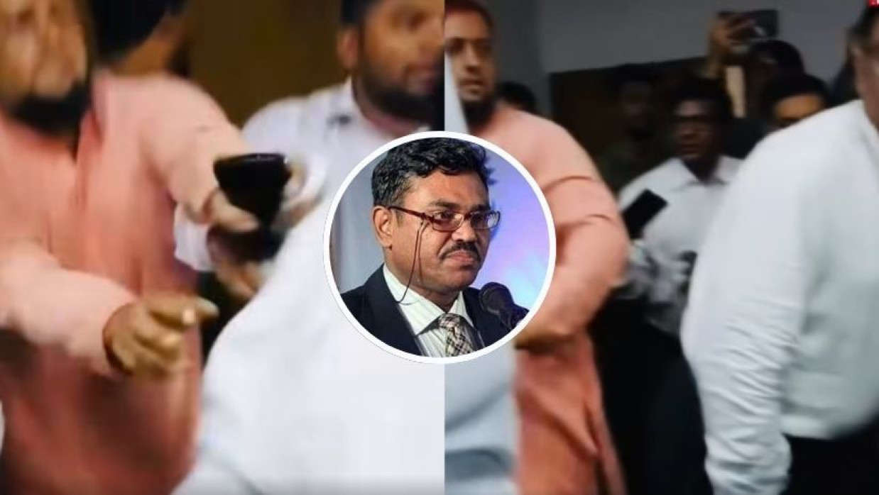 সাদা শার্ট পরিহিত অধ্যাপক শেখ হাফিজুর রহমান কার্জন