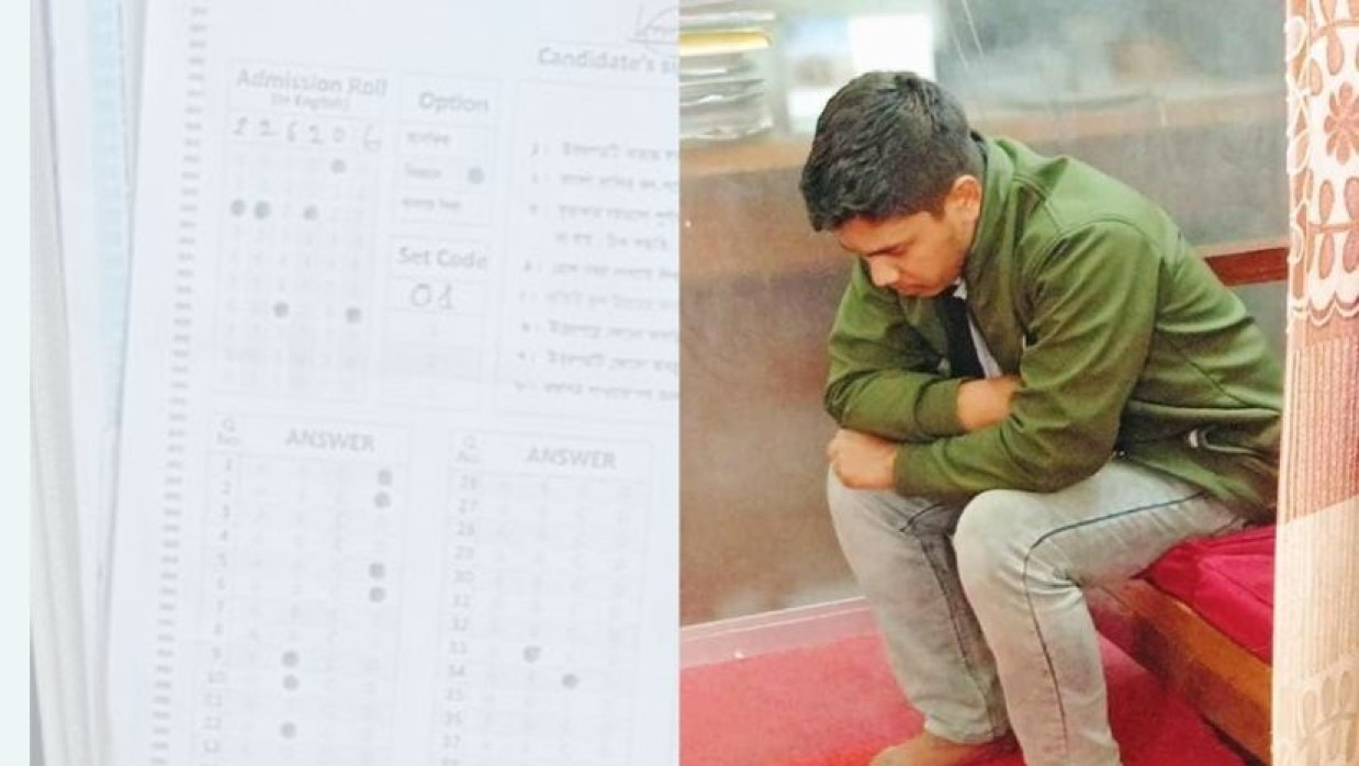 কুবি ভর্তি পরীক্ষায় মোবাইল নিয়ে ধরা পড়া  রোমান সর্দার