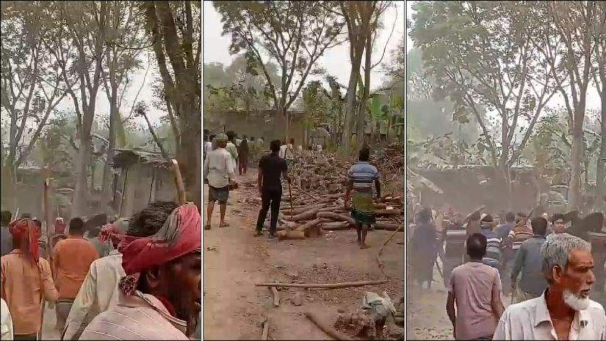 সংঘর্ষের পর ঘটনাস্থলে বিক্ষুব্ধ লোকজন ও ক্ষতিগ্রস্ত বাড়িঘর