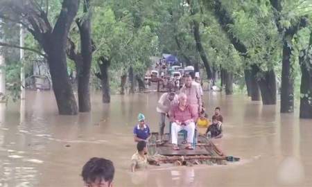 বিশেষ ভেলায় চেয়ার বসিয়ে বন্যার্তদের পাশে বিএনপির এমপি