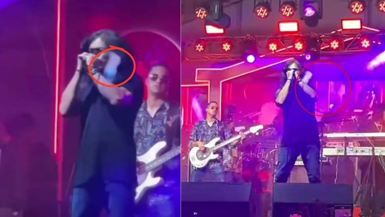 লাল বৃত্তের হাসানকে লক্ষ্য করে পানির বোতল