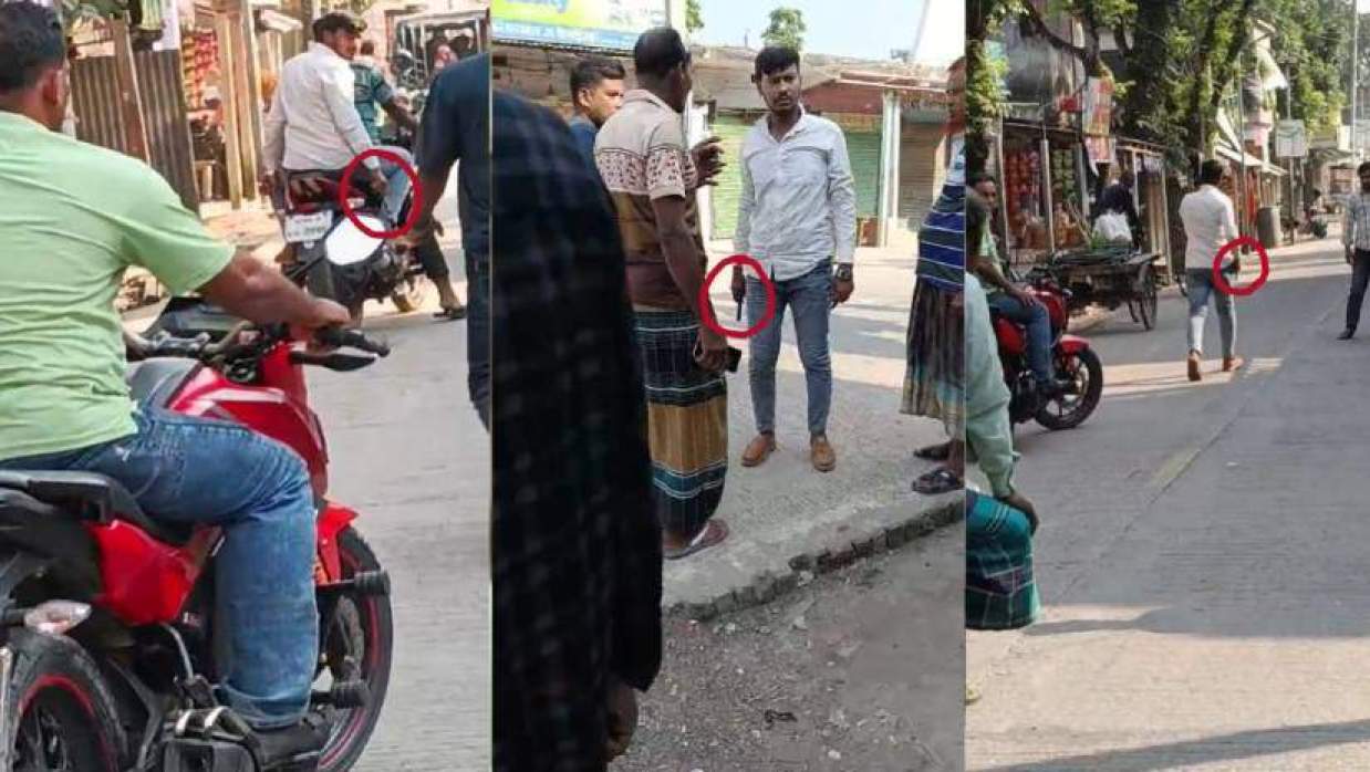 একজনের হাতে অস্ত্রসদৃশ বস্তু