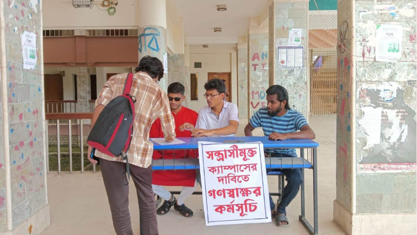 সন্ত্রাস বিরোধী গণস্বাক্ষর কর্মসূচিতে স্বাক্ষর করছেন এক শিক্ষার্থী